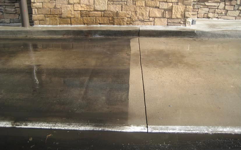 Concrete half cleaned showing the difference